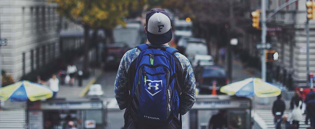 student overlooking busy street