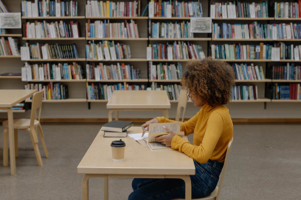 student studying in bookstore