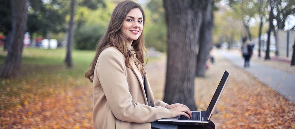 student studying at a park