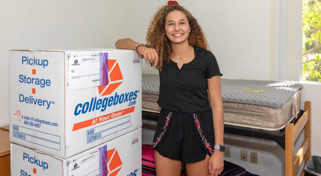 Student moving out with boxes