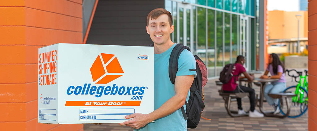College Student holding Collegeboxes shipping box