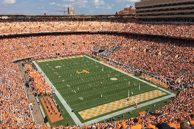 Football stadium full of people in orange and white.