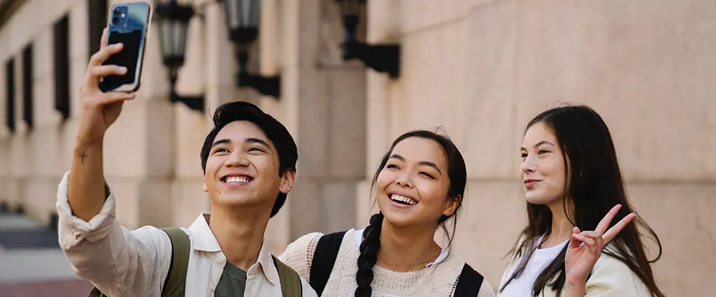 Students taking a selfie during their campus tour