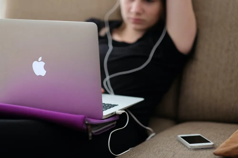 College student looking at her lap top.