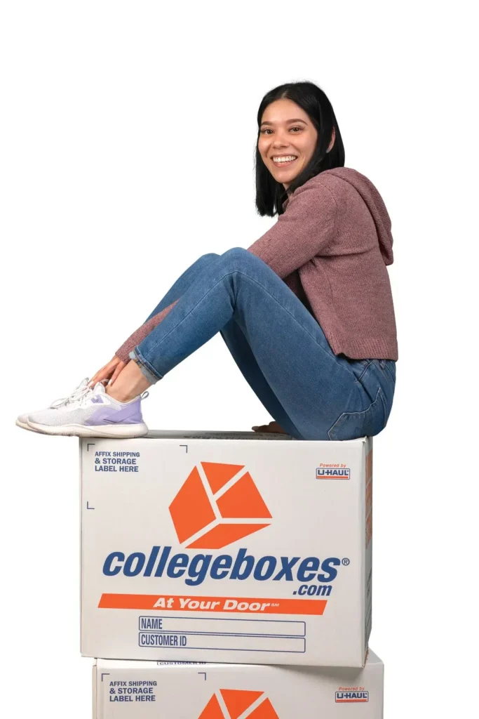 Girl sitting on a stack of boxes