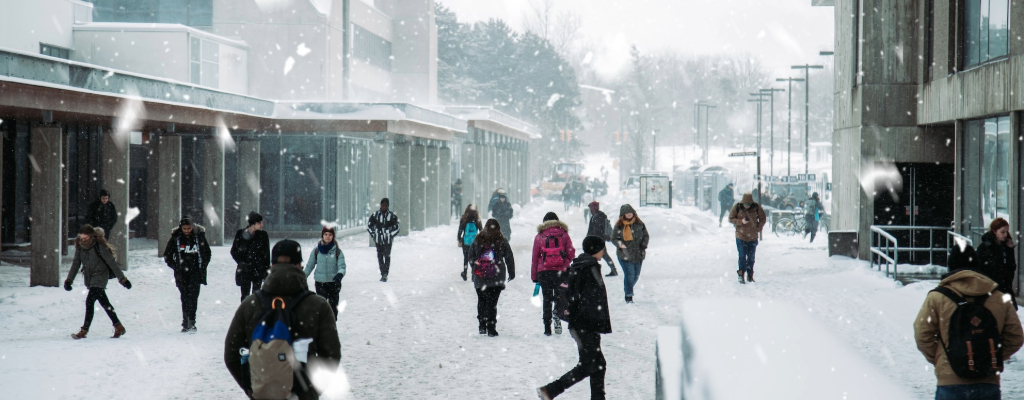 Students walking around in the snow