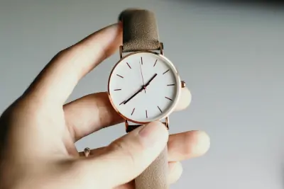 Hand holding a wrist watch