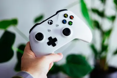 Hand holding an X-Box controller