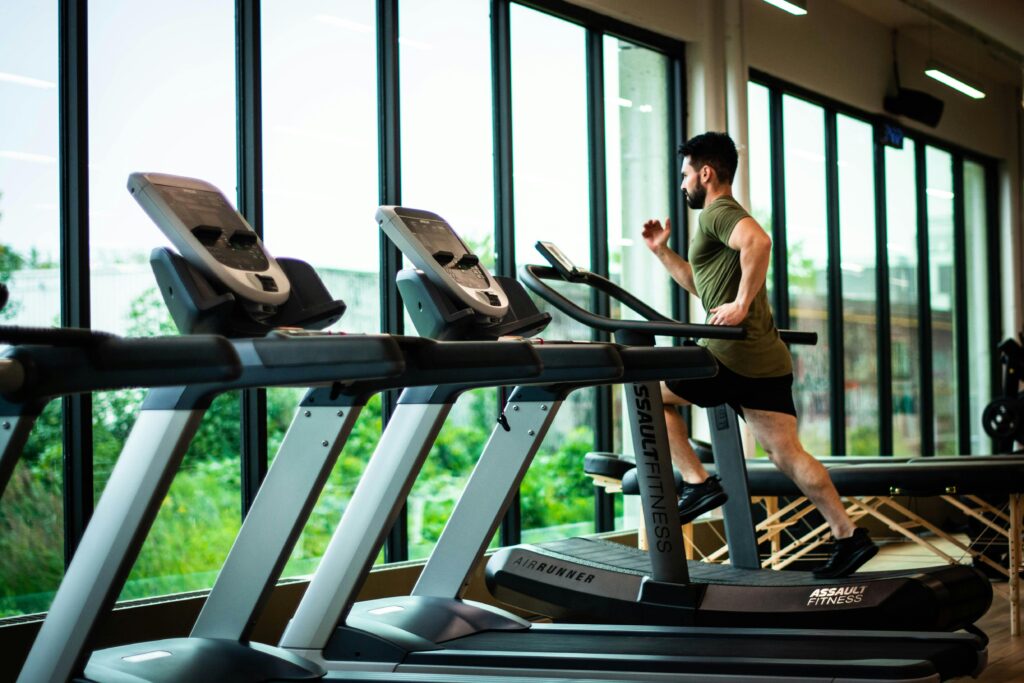 man running on a treadmill in the gym