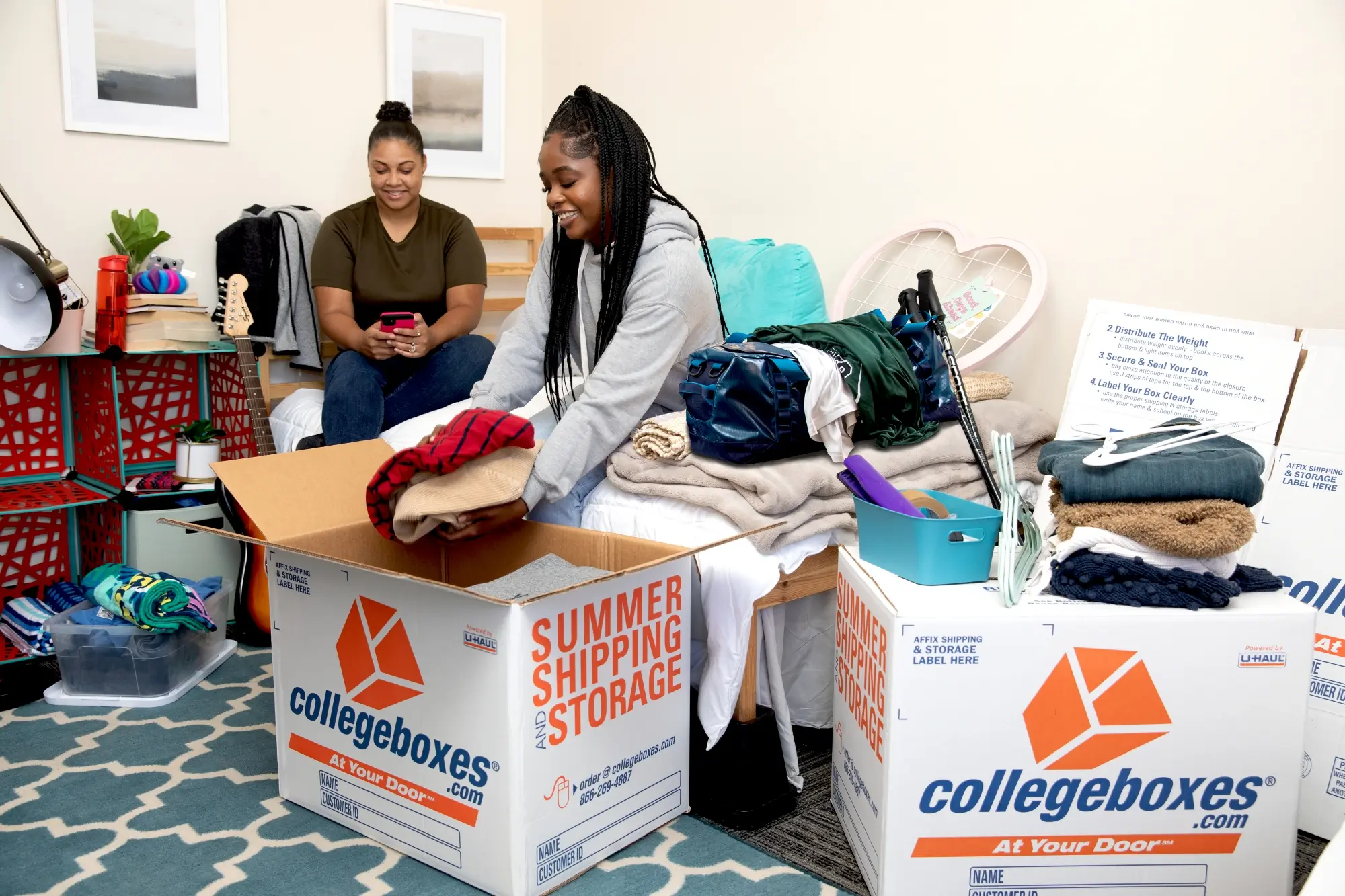 College student packing a box